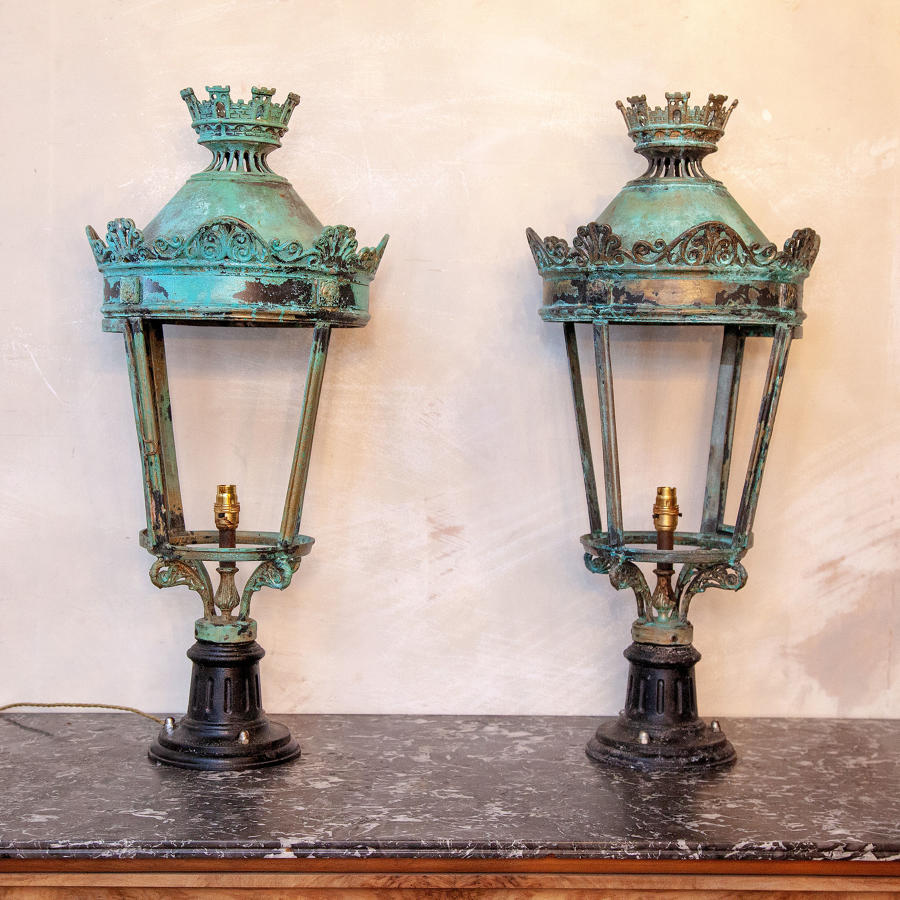 A stunning pair of patinated Verd Gris bronze lamps in the Regency sty