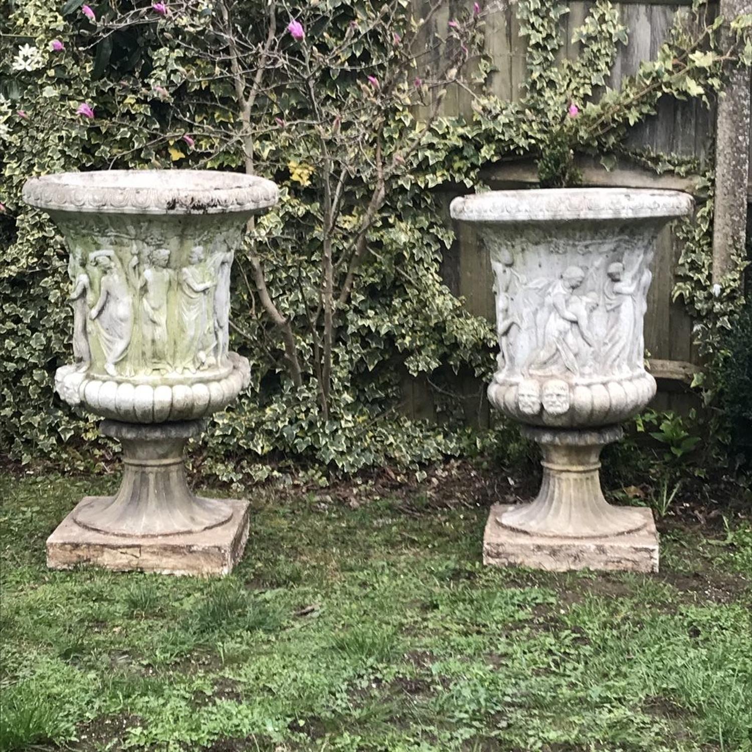 Pair of large relief moulded Medici Urns